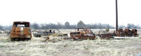 Bradshaw Texas junkyard with burnt cars