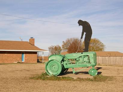 Green tractor with golfing silhouette, Knox City TX